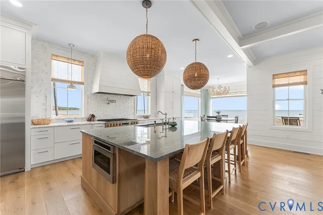 a kitchen with center island and windows