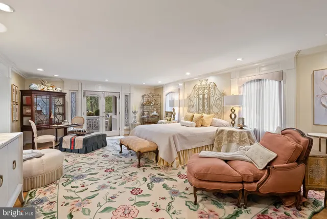 a spacious bedroom with a bed and a fireplace