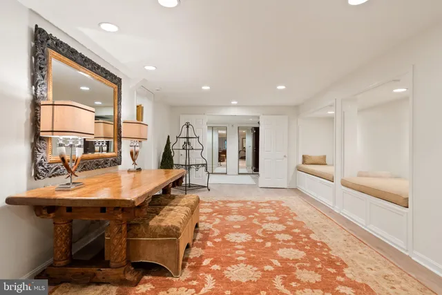 a front view of a house with a yard and potted plants
