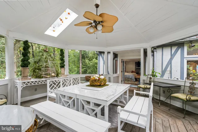 a kitchen with stainless steel appliances a stove a sink and a white cabinets