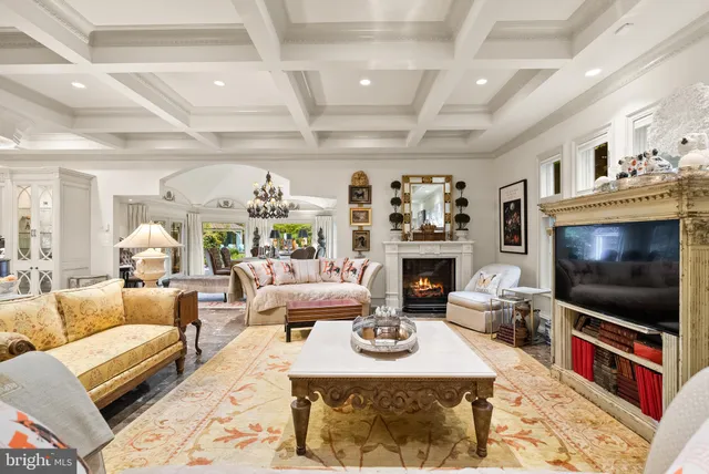 a living room with furniture or couches and a dining table with kitchen view