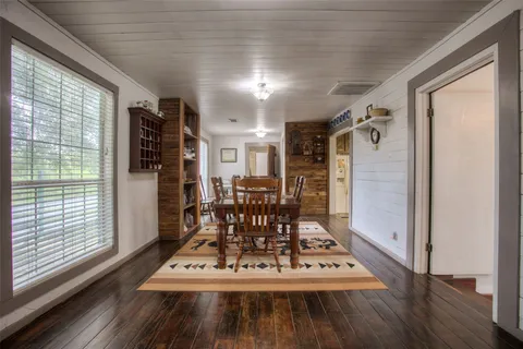a living room with furniture and a clock
