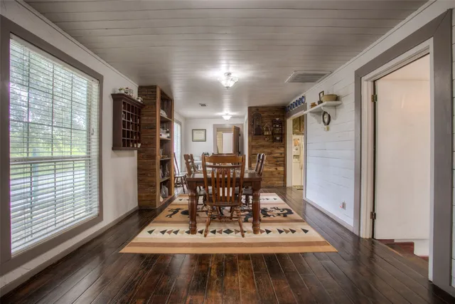 a living room with furniture and a clock