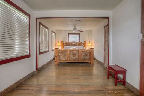 a view of a bedroom with furniture and bedroom