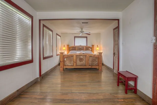 a view of a bedroom with furniture and bedroom