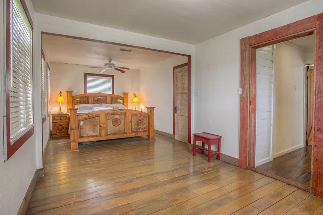 a room that has a bed and a chair in it