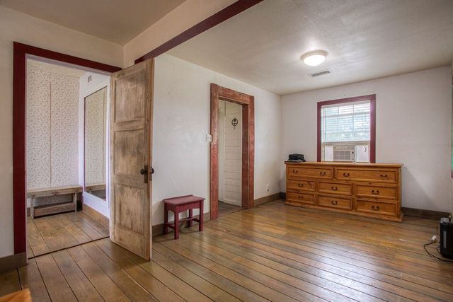 a bathroom with a granite countertop bathtub sink and toilet