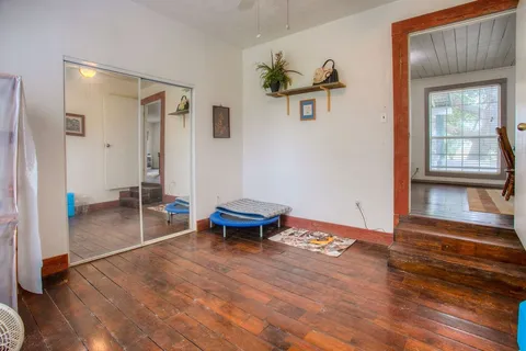 a view of a house with a backyard porch and sitting area