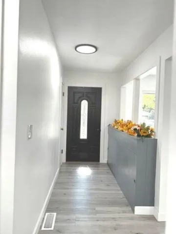 a view of entryway with wooden floor