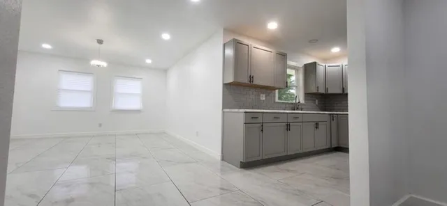 a bathroom with a sink a vanity and a mirror