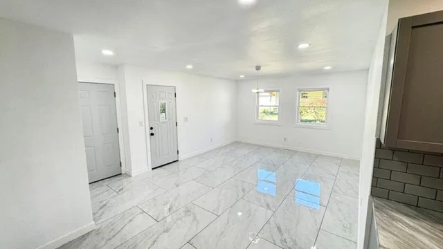 a view of an empty room and window