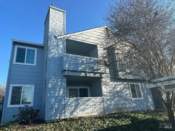 a front view of a house with yard