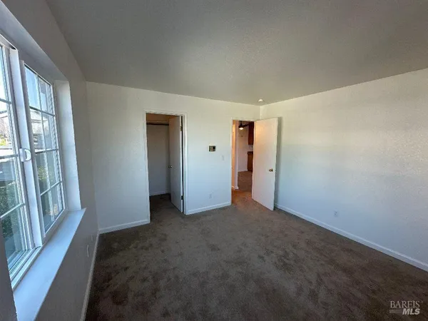 a bathroom with a sink toilet and mirror
