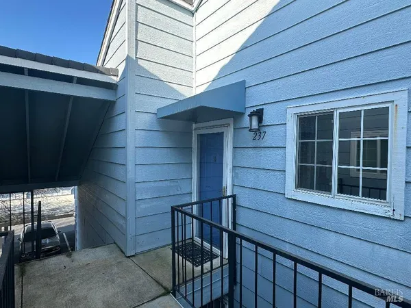 a view of front door and bedroom