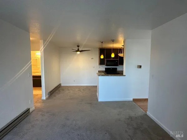 a kitchen with sink stove and refrigerator