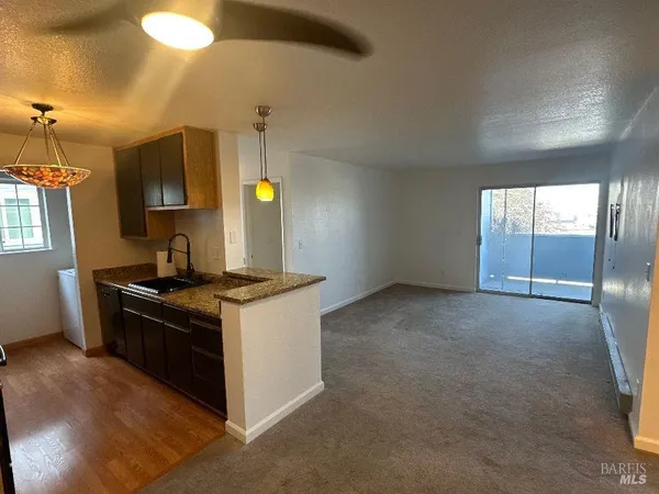a kitchen with a sink stove and refrigerator
