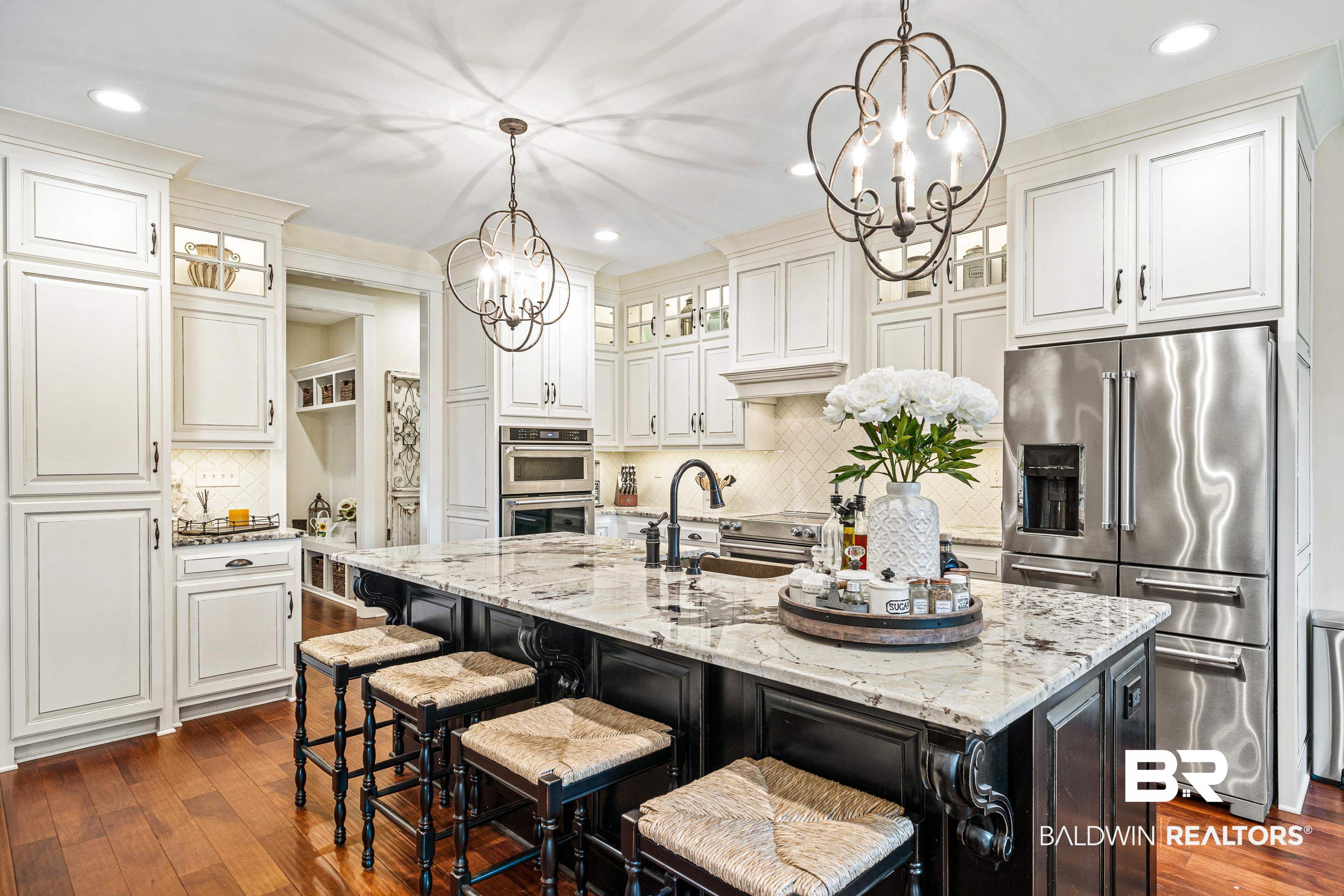 36784 Legacy Way Bay Minette, AL 36507 - Photo 15 of 57 Kitchen with a kitchen island with sink, a breakfast bar,