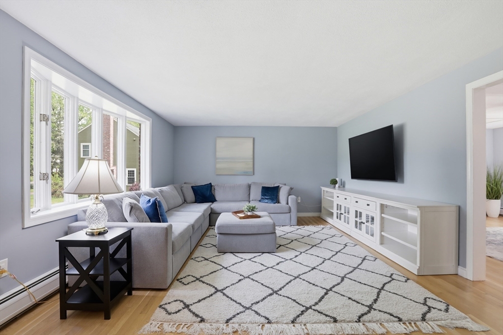 94 Johnson Road Winchester, MA 01890 - Photo 7 of 40 a living room with furniture and a flat screen tv