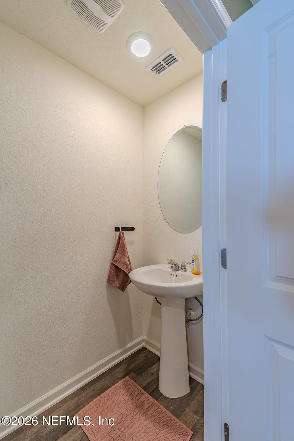 45148 Red Brick Drive Callahan, FL 32011 - Photo 11 of 32 a bathroom with a sink and mirror