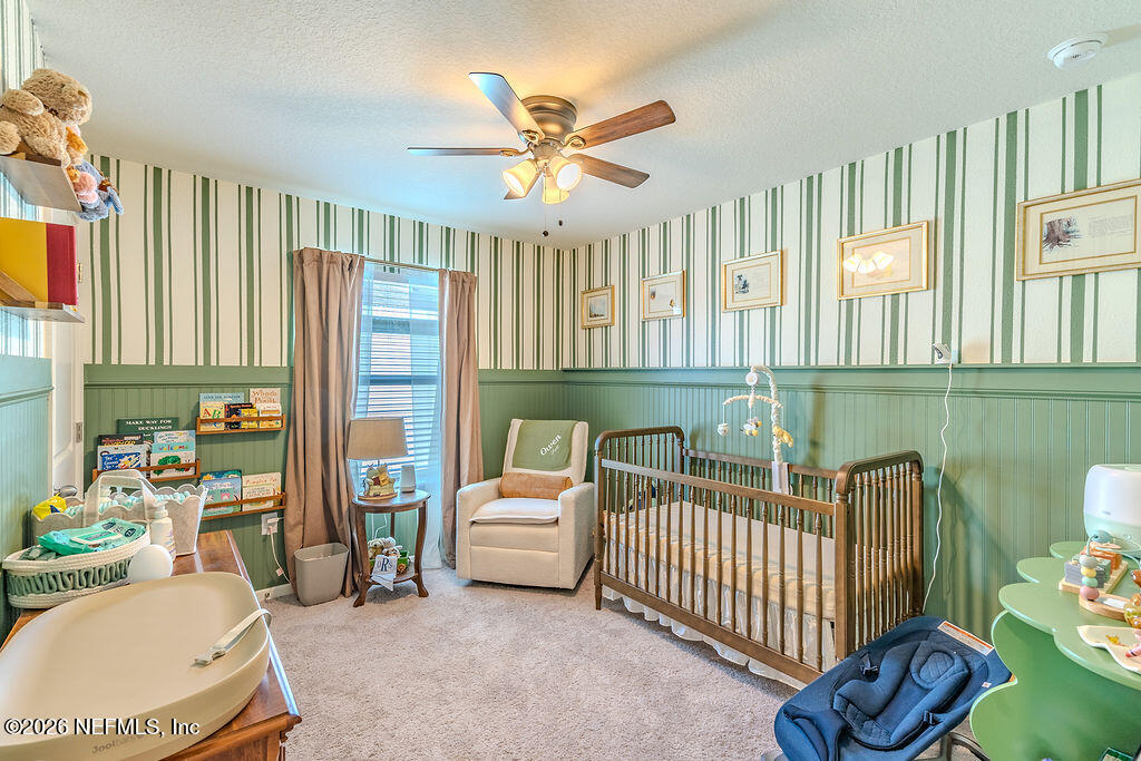 45148 Red Brick Drive Callahan, FL 32011 - Photo 16 of 32 a bedroom with furniture and a large window