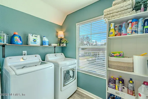 a utility room with dryer and washer
