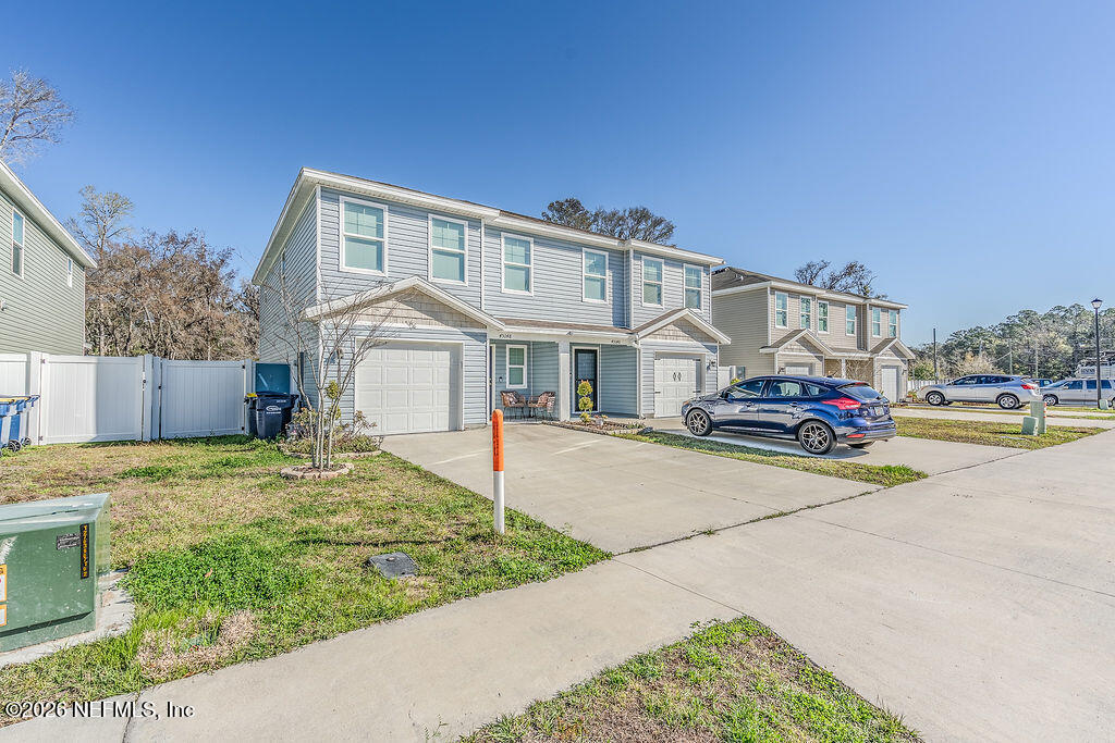 45148 Red Brick Drive Callahan, FL 32011 - Photo 3 of 32 a front view of a house with garden