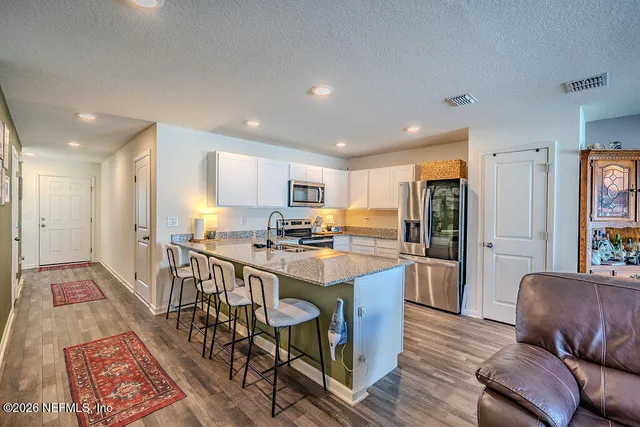 a view of a dining room with furniture