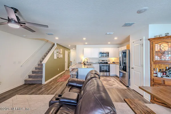 a living room with furniture and a table