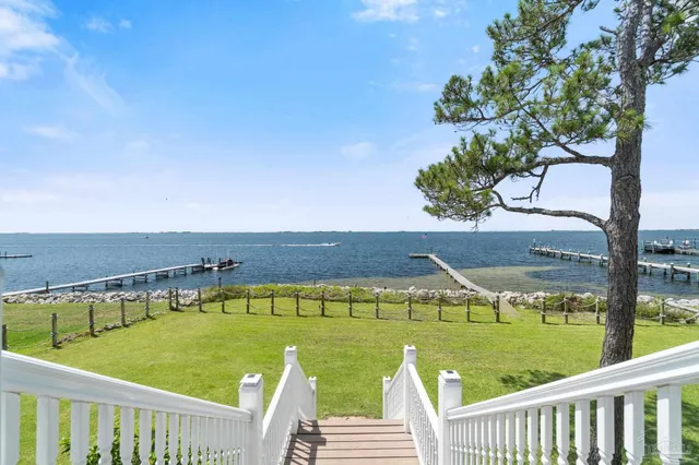 a living room with furniture a fireplace and a table