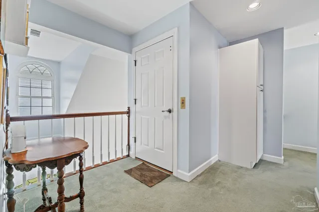an aerial view of a house with outdoor space