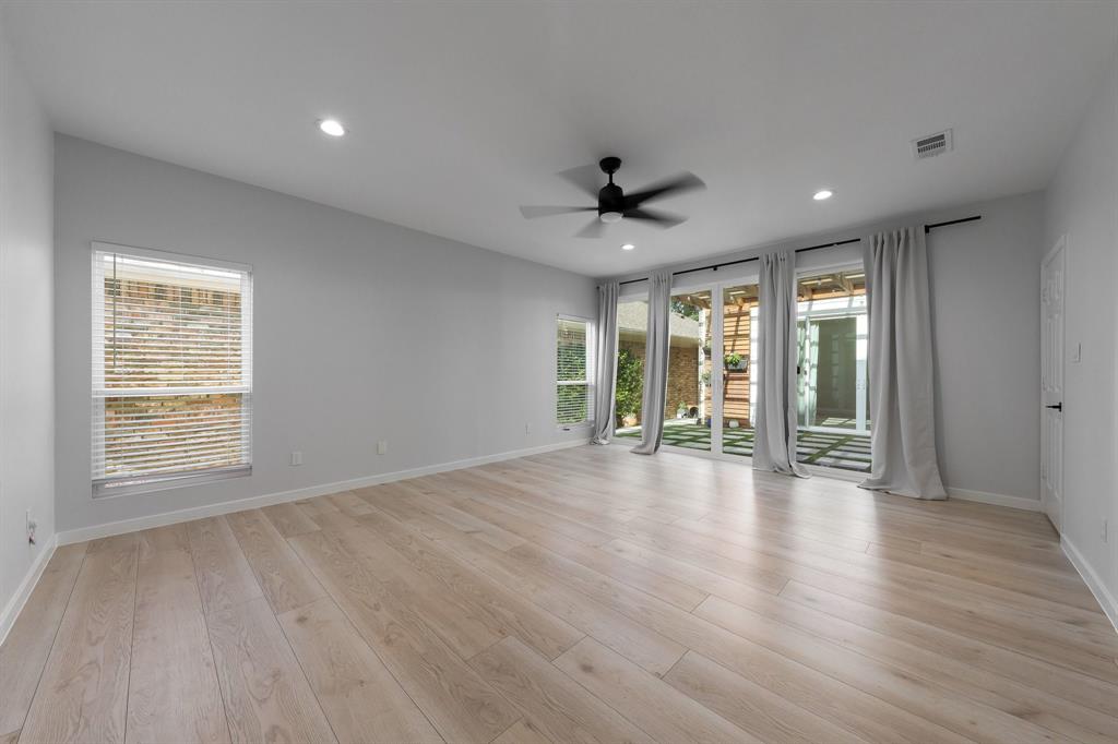 14140 Regency Place Dallas, TX 75254 - Photo 21 of 38 Spacious interior with light wood-finish flooring, recessed lighting, and a contemporary ceiling fan
