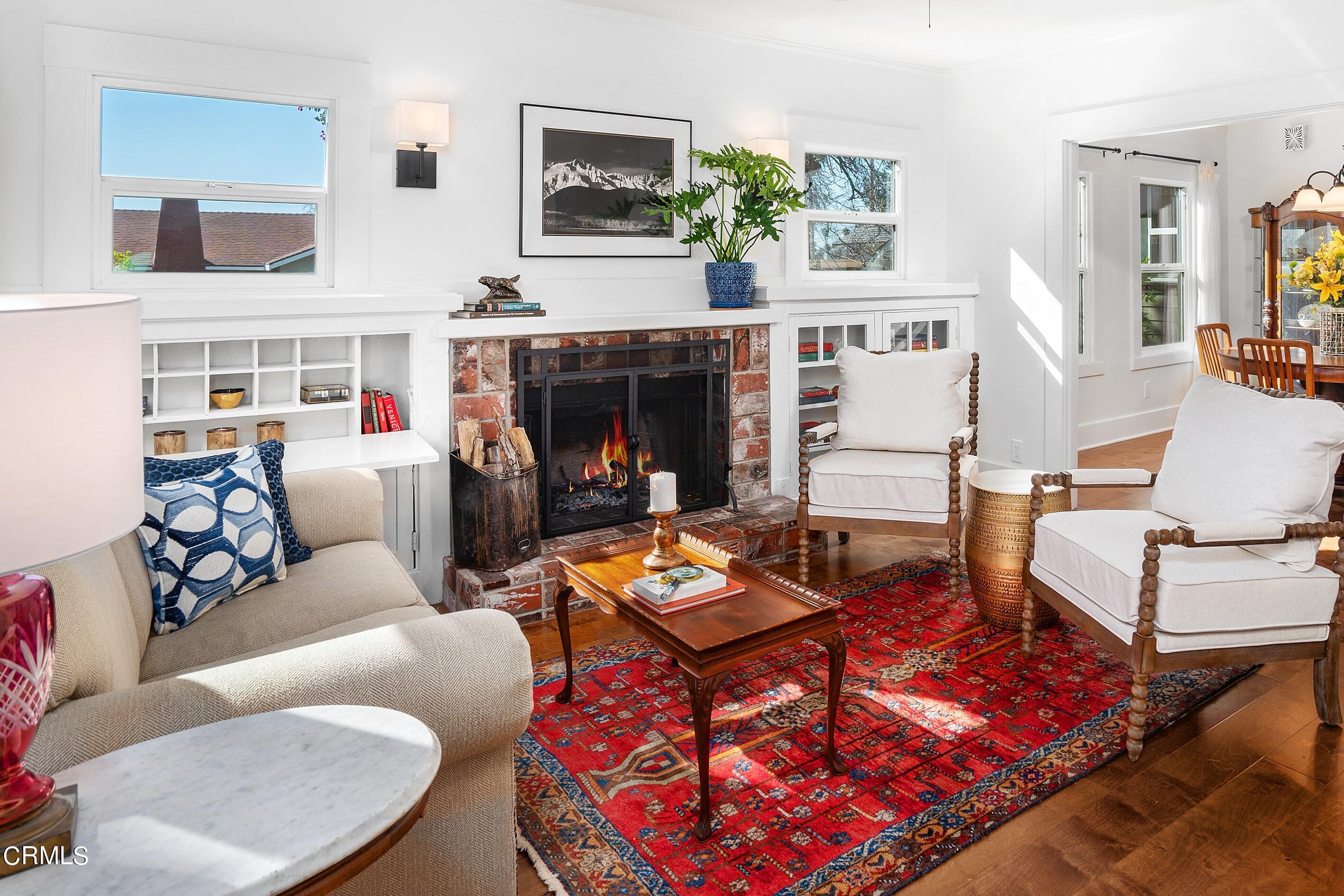 1465 Wesley Avenue Pasadena, CA 91104 - Photo 2 of 11 a living room with furniture and a fireplace