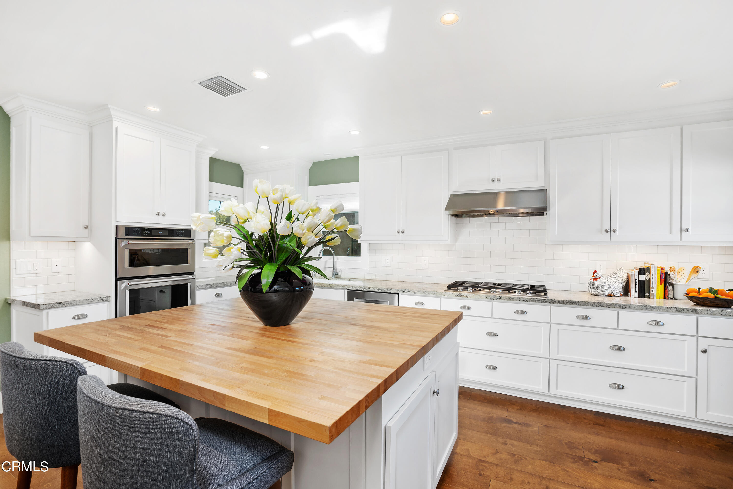 1465 Wesley Avenue Pasadena, CA 91104 - Photo 4 of 11 a kitchen with kitchen island a stove cabinets and wooden floor