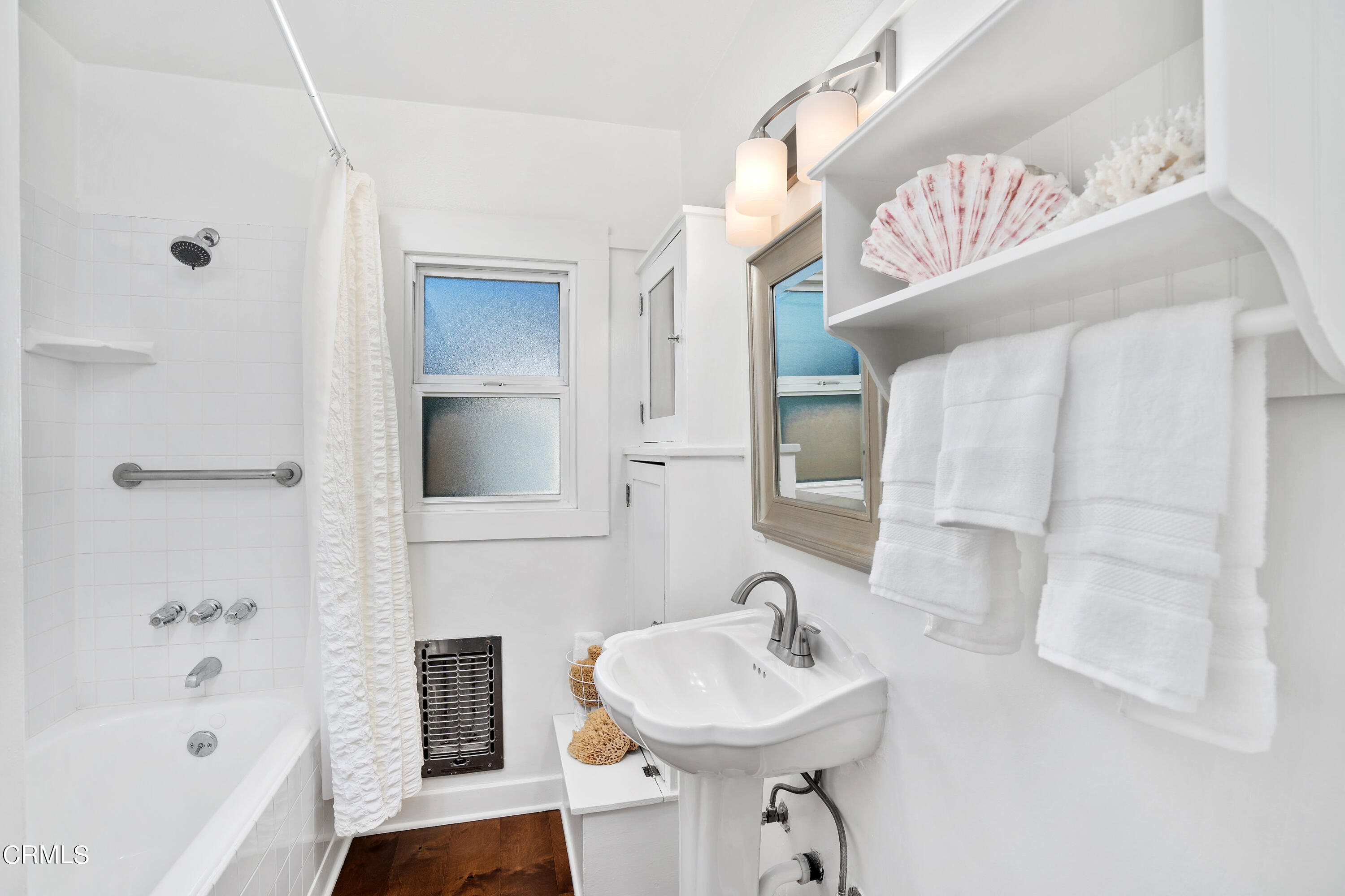 1465 Wesley Avenue Pasadena, CA 91104 - Photo 6 of 11 a bathroom with a sink a toilet and shower