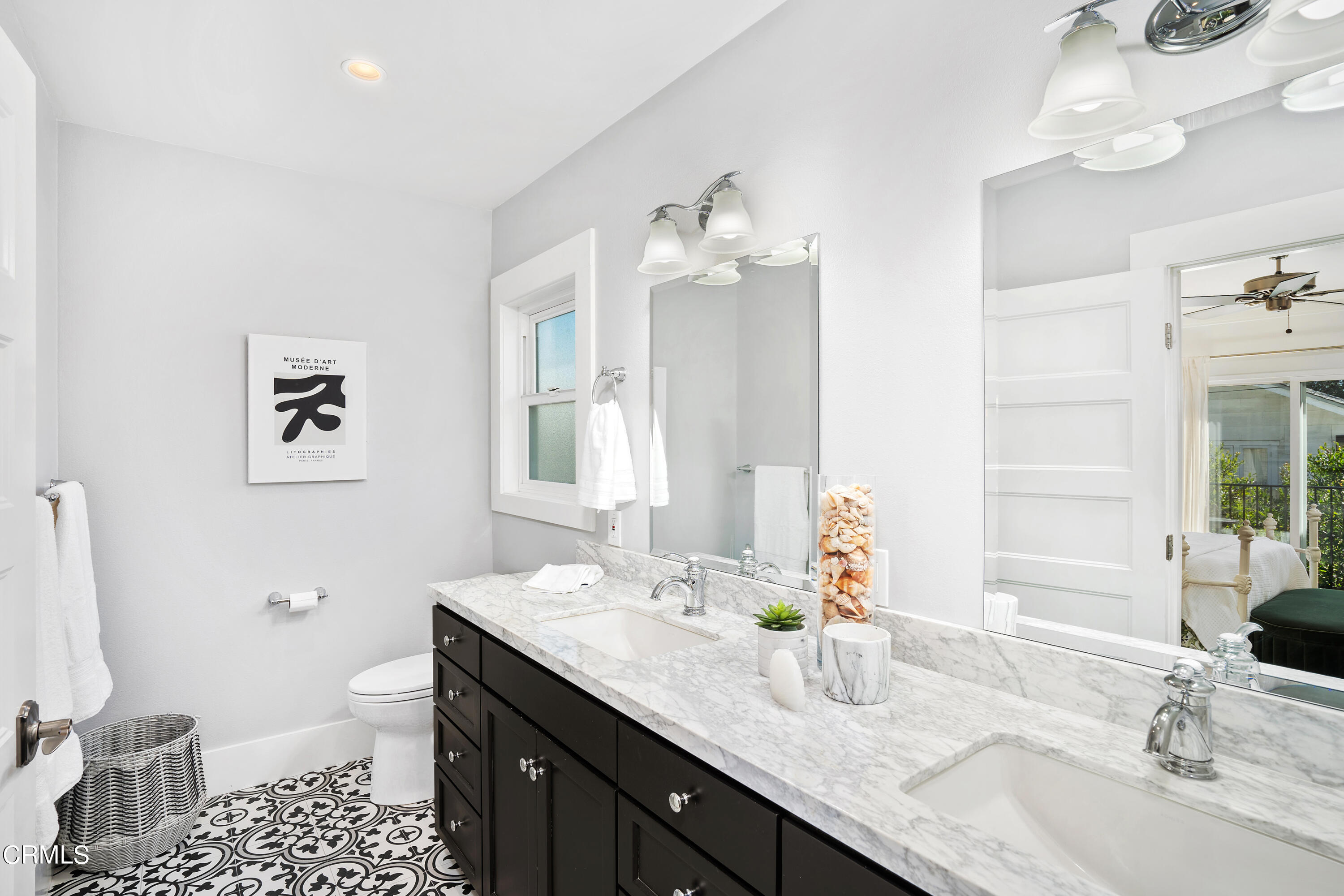 1465 Wesley Avenue Pasadena, CA 91104 - Photo 9 of 11 a bathroom with a granite countertop sink a toilet and a mirror