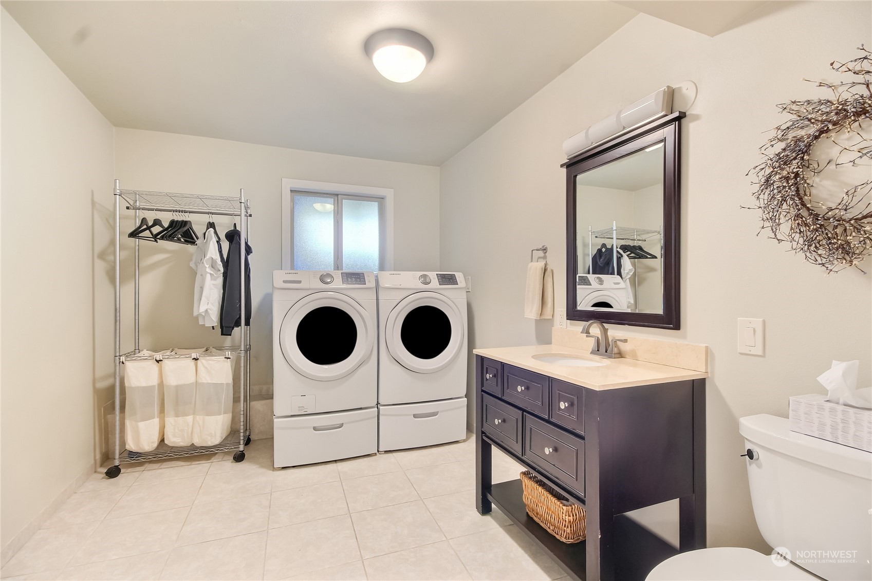 3622 Southeast 19th Court Renton, WA 98058 - Photo 34 of 37 a bathroom with a sink a mirror and shower