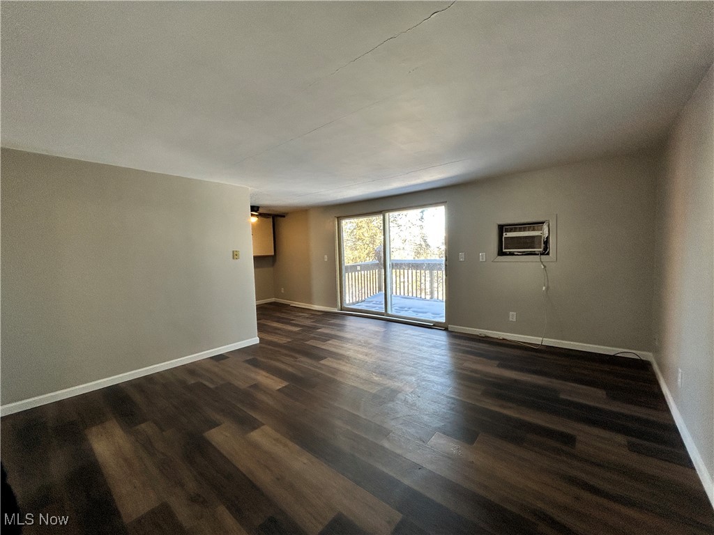 98 View Street, Unit 2 Weirton, WV 26062 - Photo 2 of 10 Unfurnished room with baseboards and dark wood-style floors