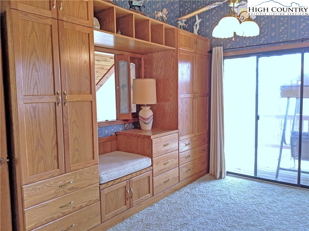 296 Grousemoor Road Deep Gap, NC 28618 - Photo 15 of 27 a kitchen with stainless steel appliances granite countertop a refrigerator and a wooden floor