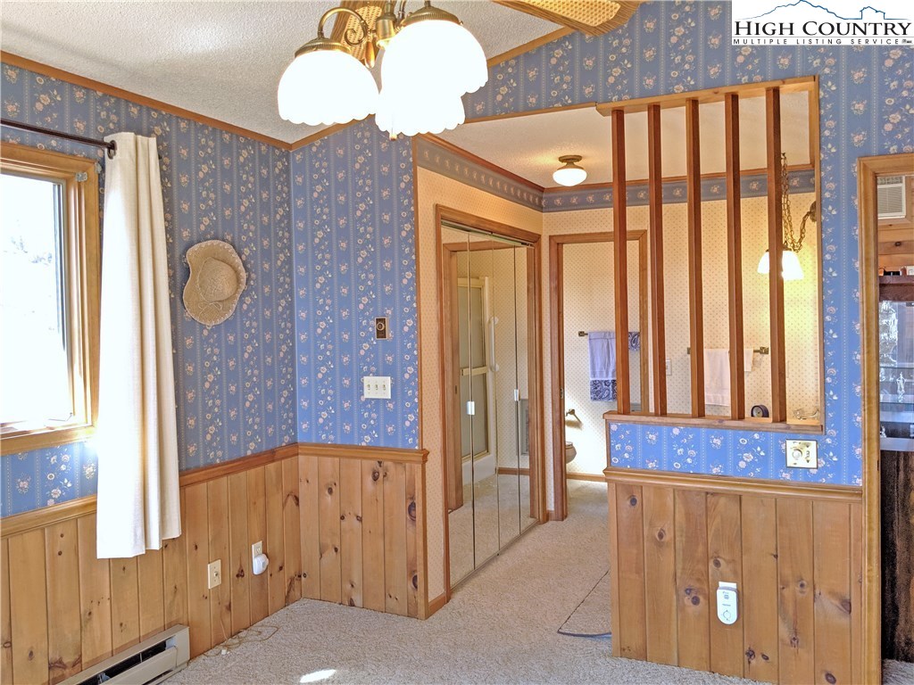 296 Grousemoor Road Deep Gap, NC 28618 - Photo 16 of 27 a bathroom with a mirror and a shower