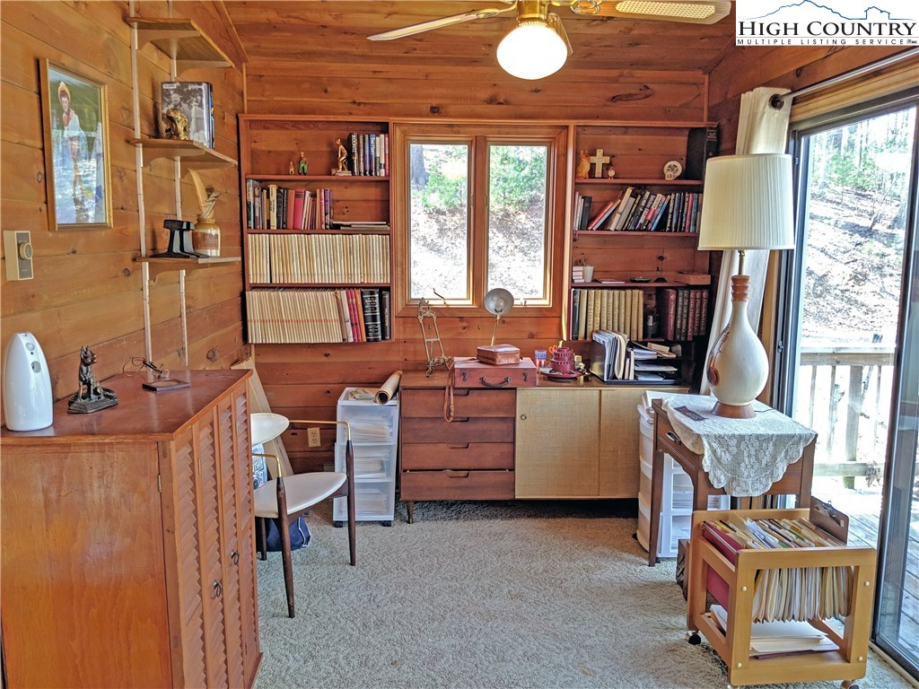 296 Grousemoor Road Deep Gap, NC 28618 - Photo 19 of 27 a view of a workspace with furniture and a window