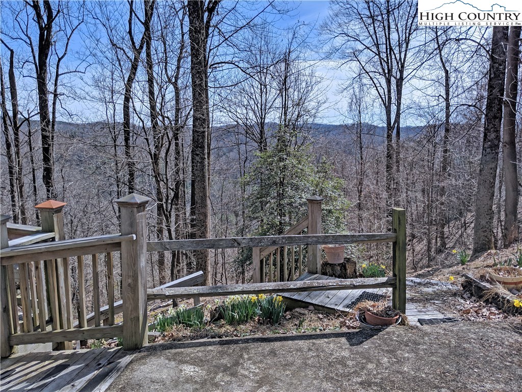 296 Grousemoor Road Deep Gap, NC 28618 - Photo 20 of 27 a view of a wooden fence next to a yard