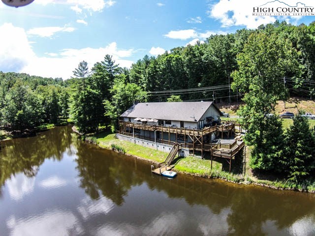 296 Grousemoor Road Deep Gap, NC 28618 - Photo 23 of 27 a view of a swimming pool with lounge chair