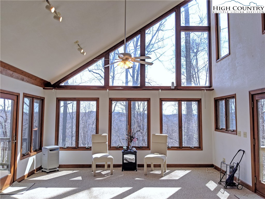 296 Grousemoor Road Deep Gap, NC 28618 - Photo 4 of 27 a living room with furniture and large windows