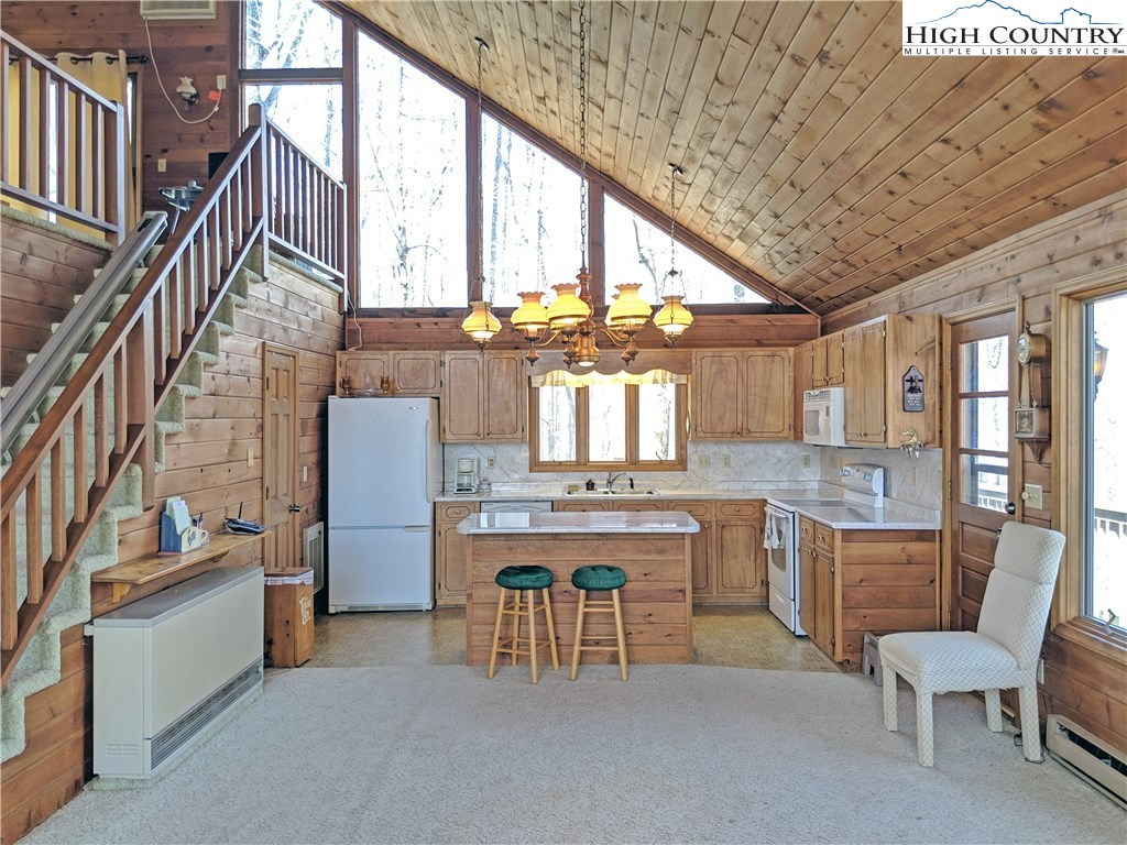 296 Grousemoor Road Deep Gap, NC 28618 - Photo 5 of 27 a kitchen with stove and cabinets