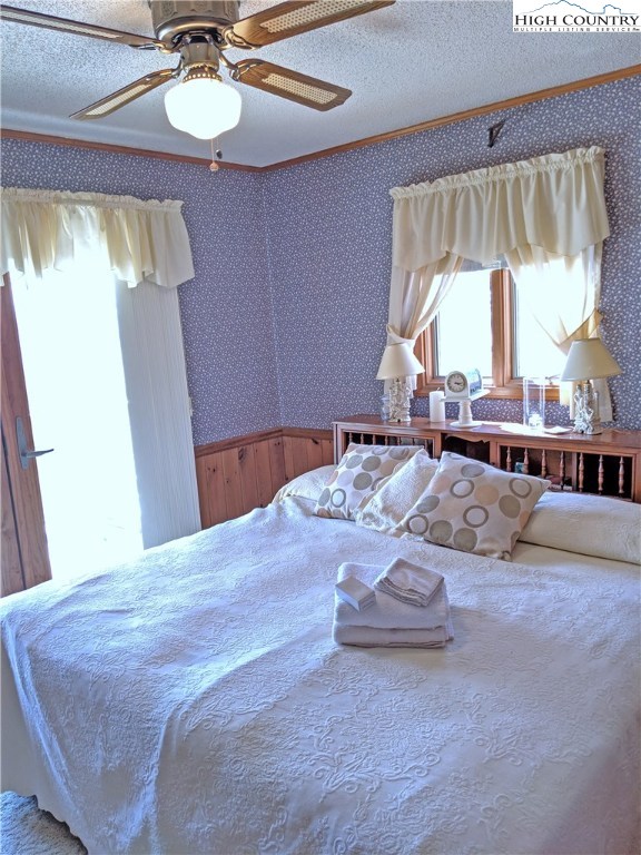 296 Grousemoor Road Deep Gap, NC 28618 - Photo 8 of 27 a bed sitting in a bedroom next to a window