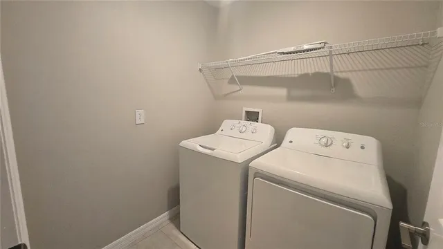 a bathroom with a granite countertop sink toilet a large mirror a bathtub and shower