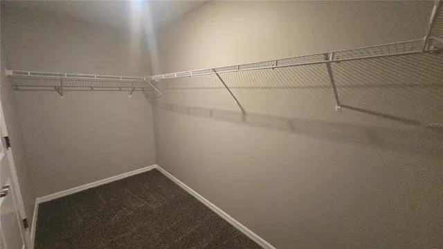 a view of a stone house with a yard