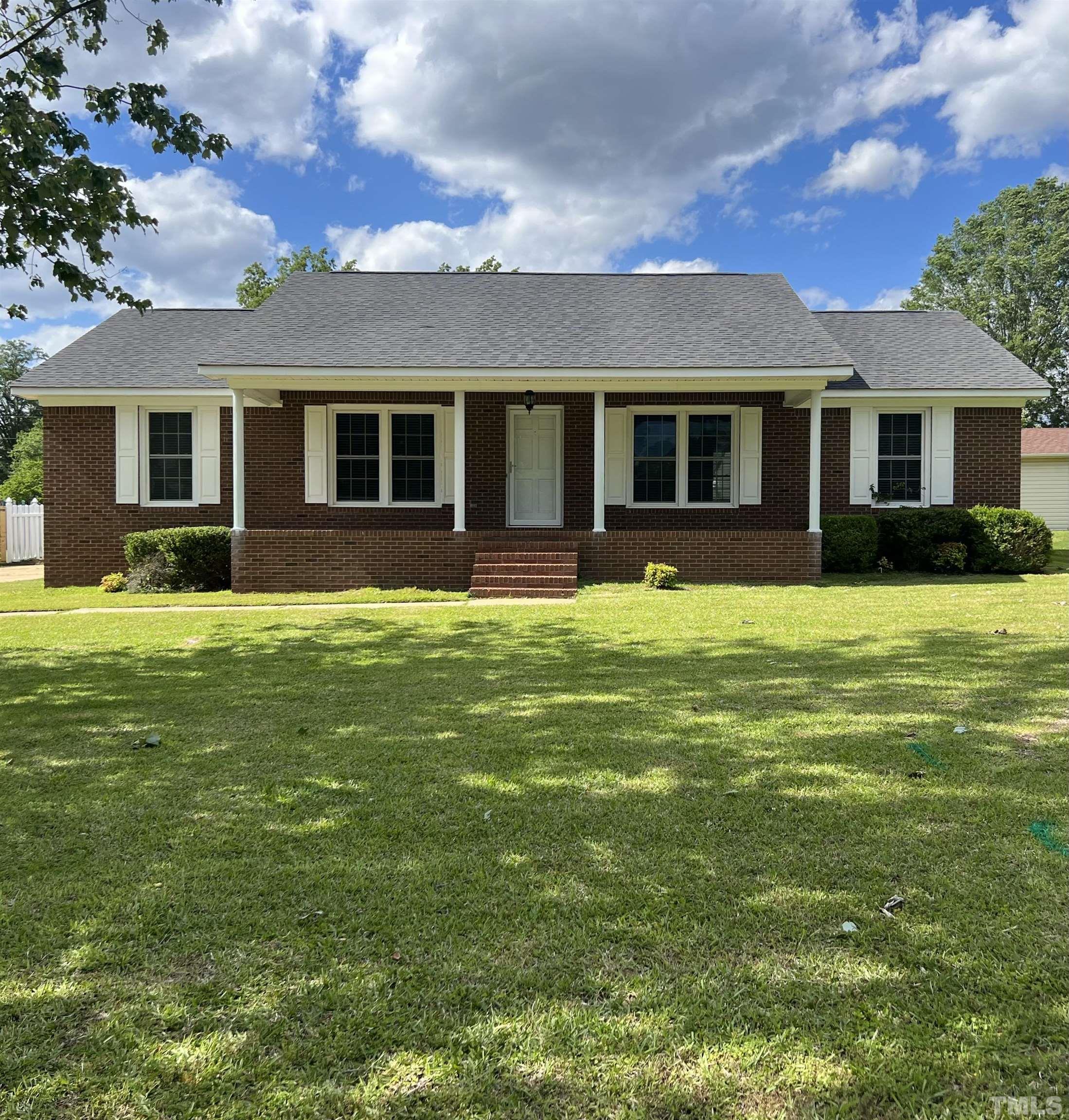 104 Marion Drive Erwin, NC 28339 - Photo 1 of 28 a front view of a house with yard and green space