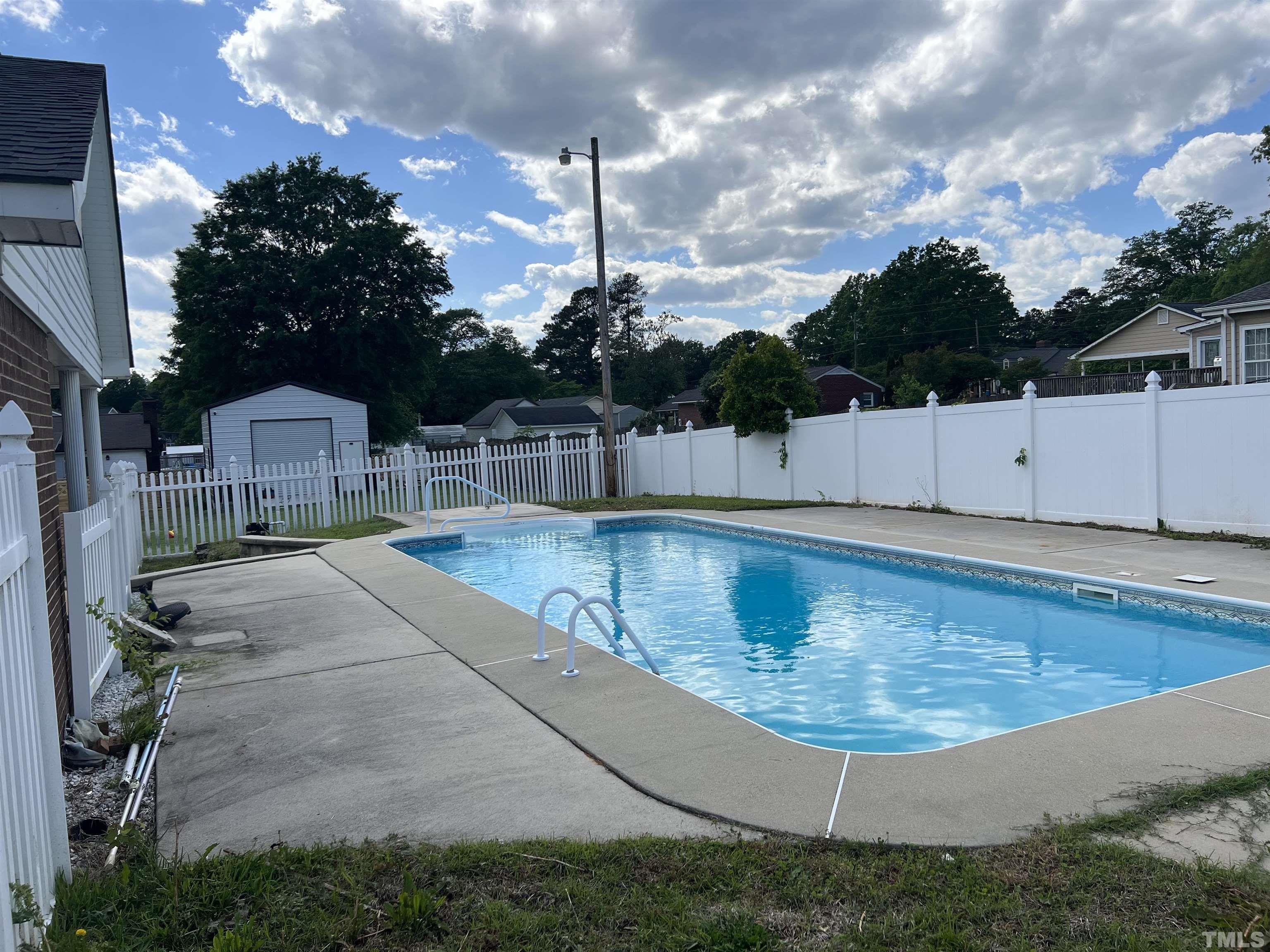 104 Marion Drive Erwin, NC 28339 - Photo 2 of 28 a view of a swimming pool with a yard