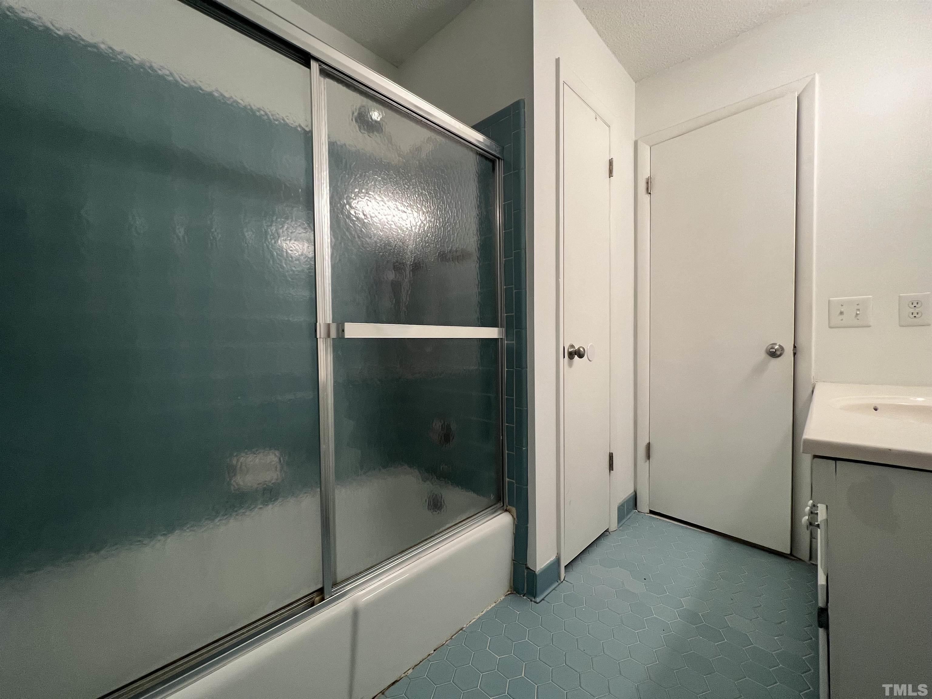 104 Marion Drive Erwin, NC 28339 - Photo 23 of 28 a bathroom with a bathtub and a shower